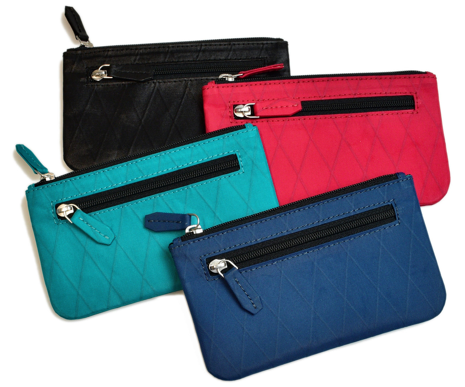 Four small quilted zipper pouches in black, red, turquoise, and blue, each with a front zipper pocket and a main zipper compartment, arranged overlapping each other.
