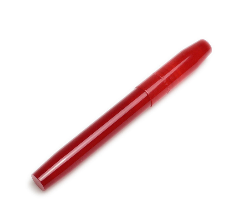 A Piper Trading Co. Franklin-Christoph Model 46 Fountain Pen in Venetian Red, capped and glossy, rests diagonally on a white background.