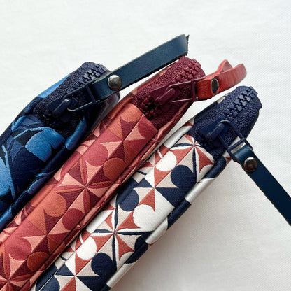 Side view of 3 patterned pen pouches