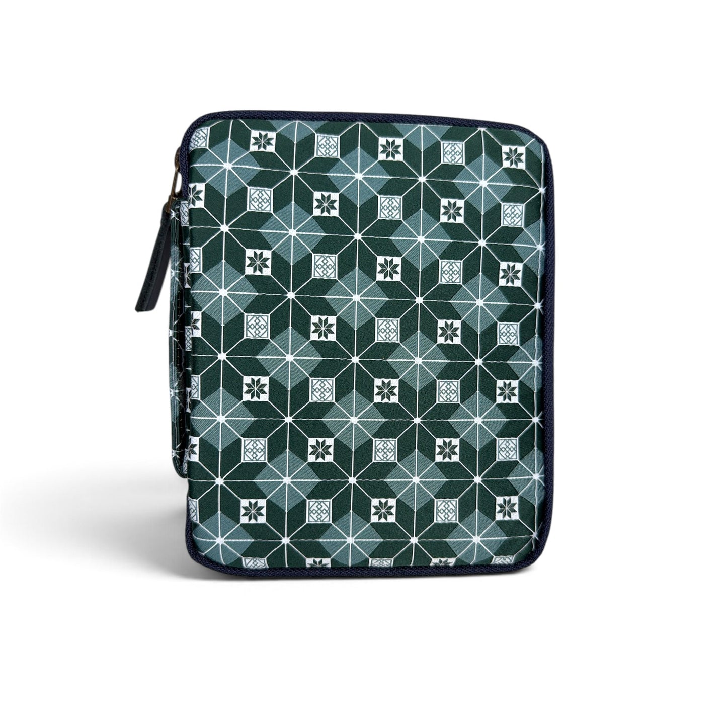 The Piper Trading Co. Kyoku Haku Restitch Emerald 5 Pen Case is a zippered pen pouch featuring a geometric pattern of squares and hexagons in shades of green, white, and blue. Perfect for storing fountain pens, the case is shown standing upright against a white background.