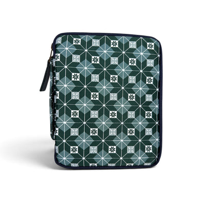 The Piper Trading Co. Kyoku Haku Restitch Emerald 5 Pen Case is a zippered pen pouch featuring a geometric pattern of squares and hexagons in shades of green, white, and blue. Perfect for storing fountain pens, the case is shown standing upright against a white background.