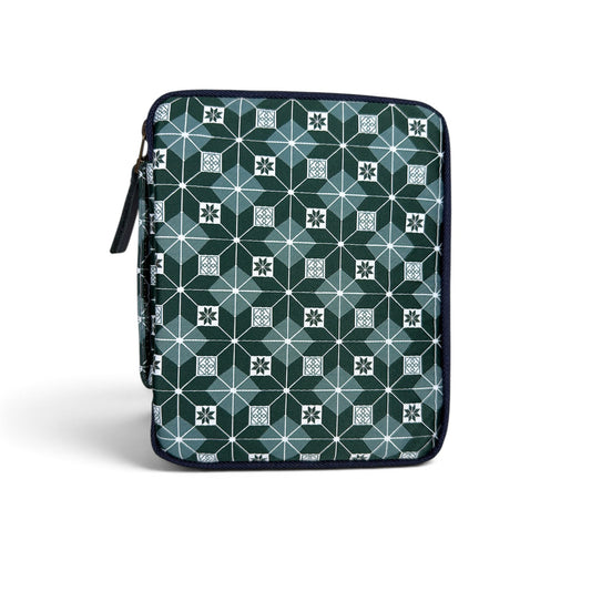 The Piper Trading Co. Kyoku Haku Restitch Emerald 5 Pen Case is a zippered pen pouch featuring a geometric pattern of squares and hexagons in shades of green, white, and blue. Perfect for storing fountain pens, the case is shown standing upright against a white background.